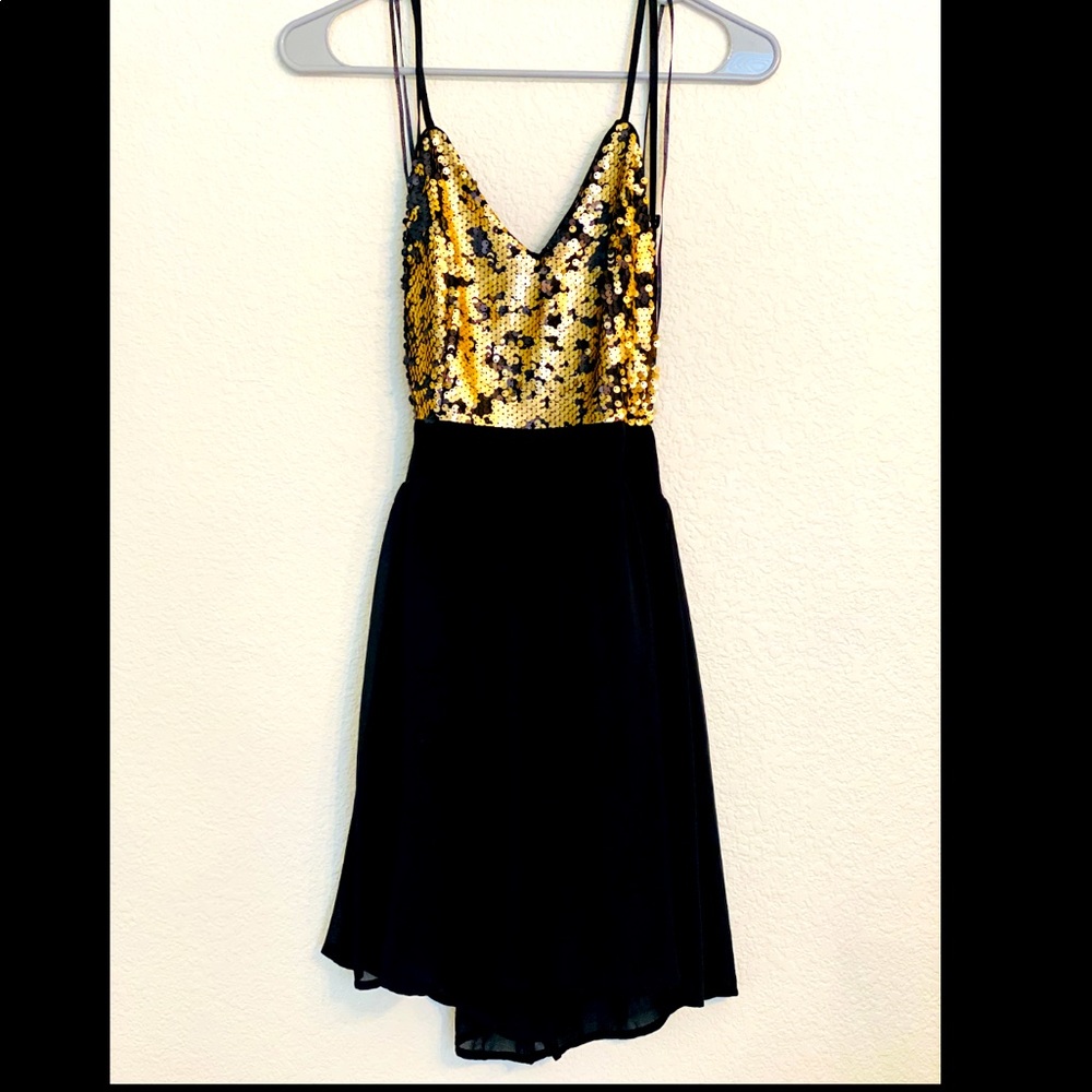 PromGirl dress. Never worn. The back is cut out and flows nicely. Short and fun!